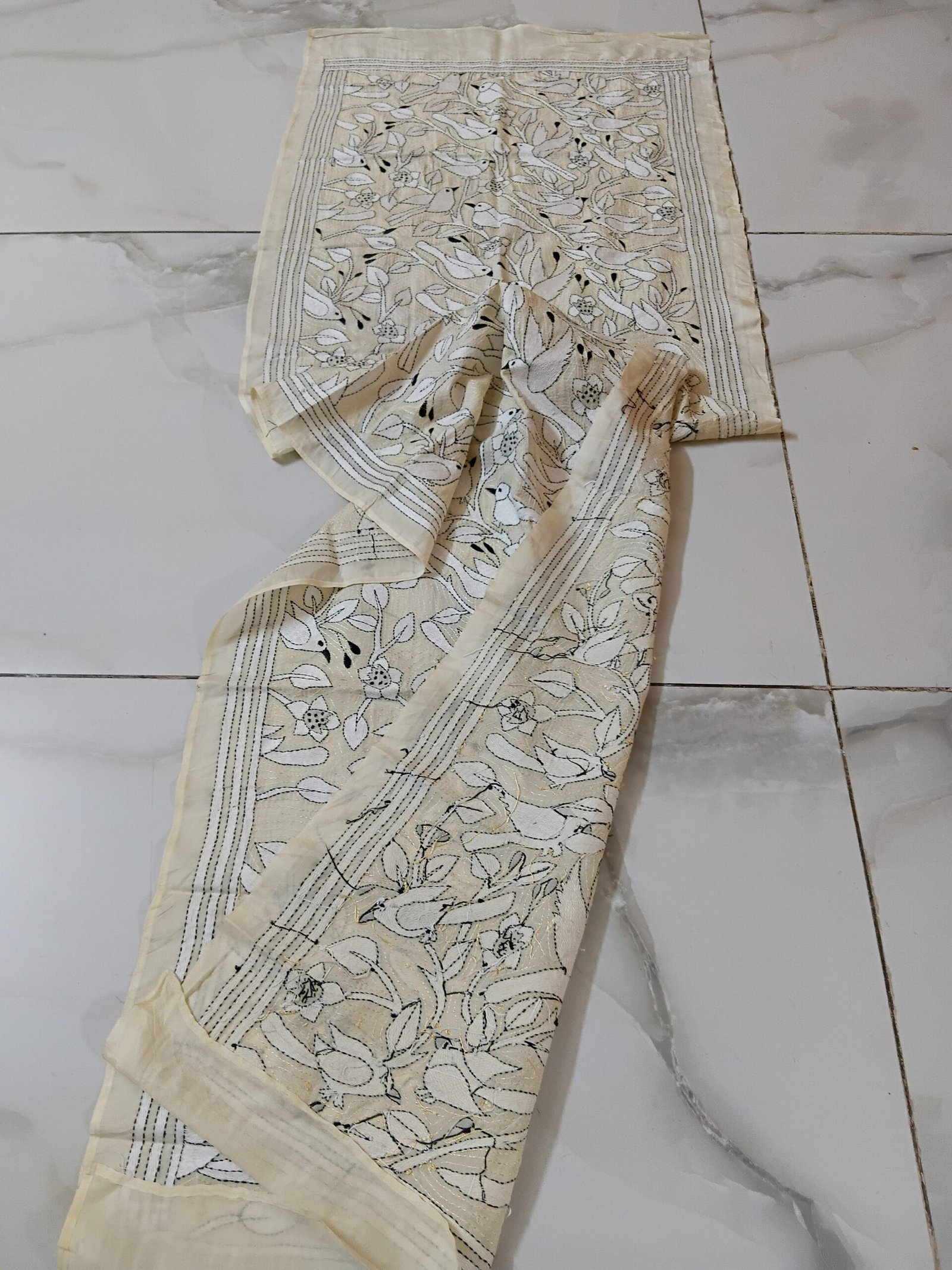 Silk Kantha Stitch Stole or Scarf % Handmade Kantha stitch stole featuring intricate hand embroidery with colorful traditional motifs on soft fabric. This elegant Bengal Kantha stole showcases detailed running-stitch artwork, ethnic craftsmanship, and a beautiful handcrafted texture, making it ideal for Indian ethnic wear, festive occasions, casual styling, gifting, and sustainable handmade fashion.