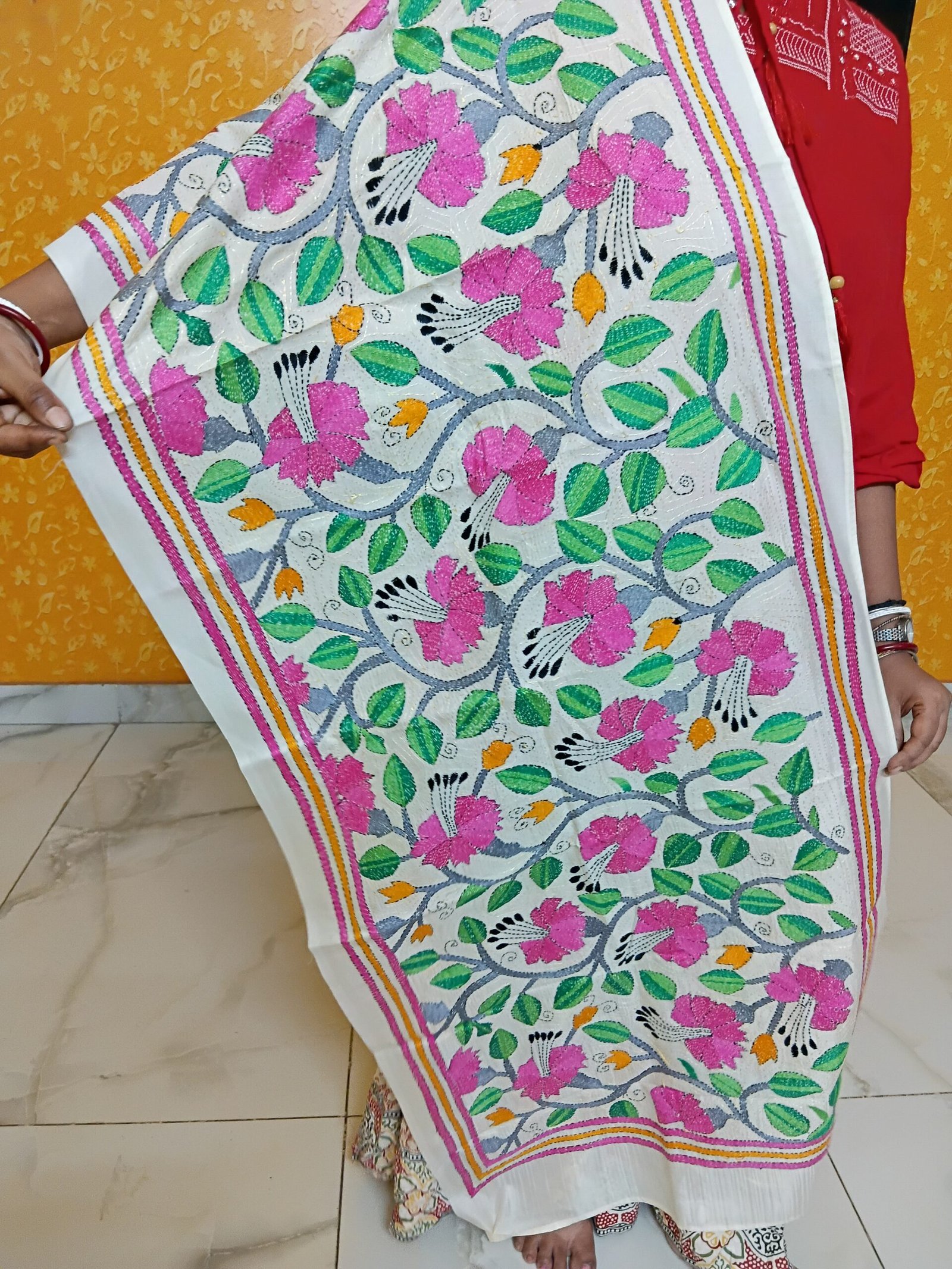 Handmade Kantha stitch stole featuring intricate hand embroidery with colorful traditional motifs on soft fabric. This elegant Bengal Kantha stole showcases detailed running-stitch artwork, ethnic craftsmanship, and a beautiful handcrafted texture, making it ideal for Indian ethnic wear, festive occasions, casual styling, gifting, and sustainable handmade fashion.