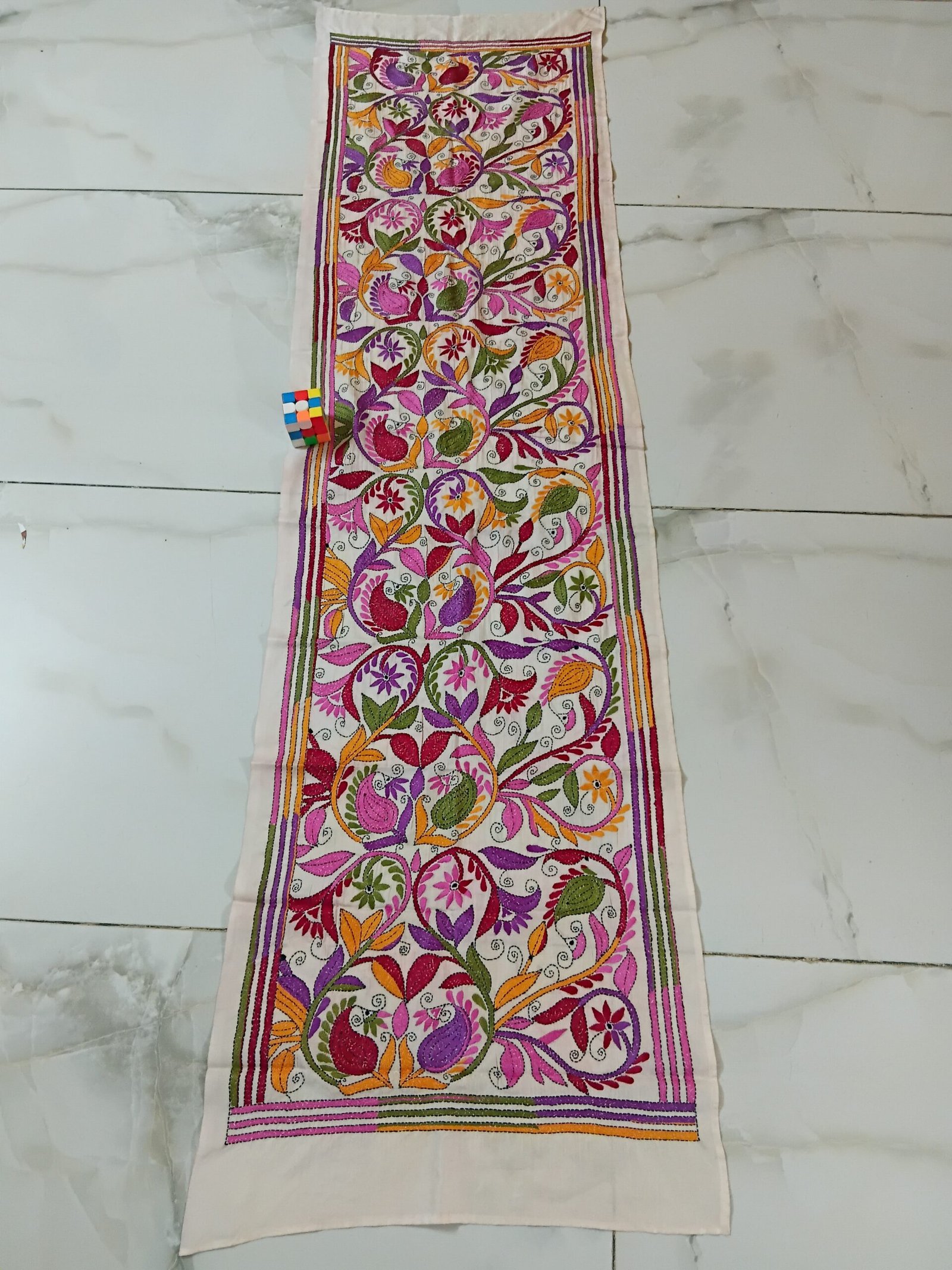 Silk Kantha Stitch Stole or Scarf % Handmade Kantha stitch stole featuring intricate hand embroidery with colorful traditional motifs on soft fabric. This elegant Bengal Kantha stole showcases detailed running-stitch artwork, ethnic craftsmanship, and a beautiful handcrafted texture, making it ideal for Indian ethnic wear, festive occasions, casual styling, gifting, and sustainable handmade fashion.