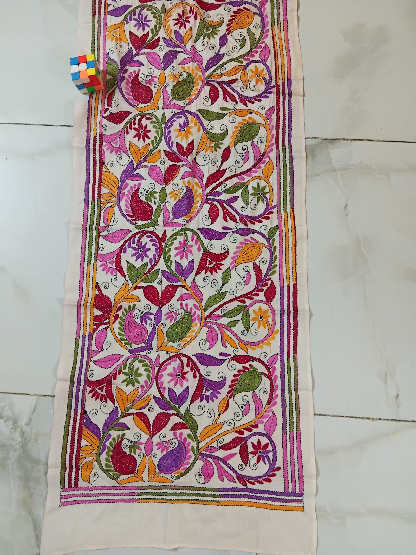 Silk Kantha Stitch Stole or Scarf % Handmade Kantha stitch stole featuring intricate hand embroidery with colorful traditional motifs on soft fabric. This elegant Bengal Kantha stole showcases detailed running-stitch artwork, ethnic craftsmanship, and a beautiful handcrafted texture, making it ideal for Indian ethnic wear, festive occasions, casual styling, gifting, and sustainable handmade fashion.