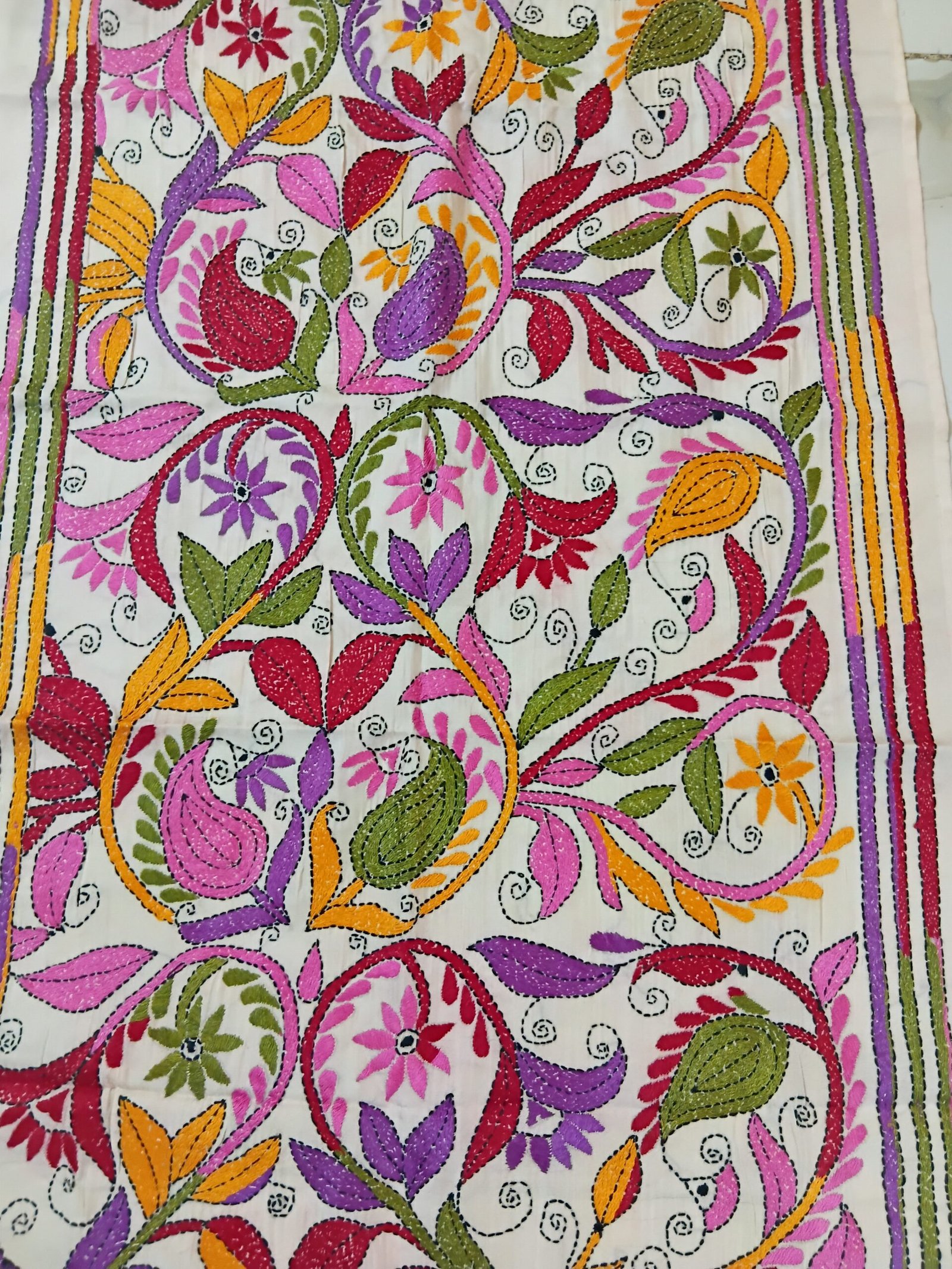 Silk Kantha Stitch Stole or Scarf % Handmade Kantha stitch stole featuring intricate hand embroidery with colorful traditional motifs on soft fabric. This elegant Bengal Kantha stole showcases detailed running-stitch artwork, ethnic craftsmanship, and a beautiful handcrafted texture, making it ideal for Indian ethnic wear, festive occasions, casual styling, gifting, and sustainable handmade fashion.