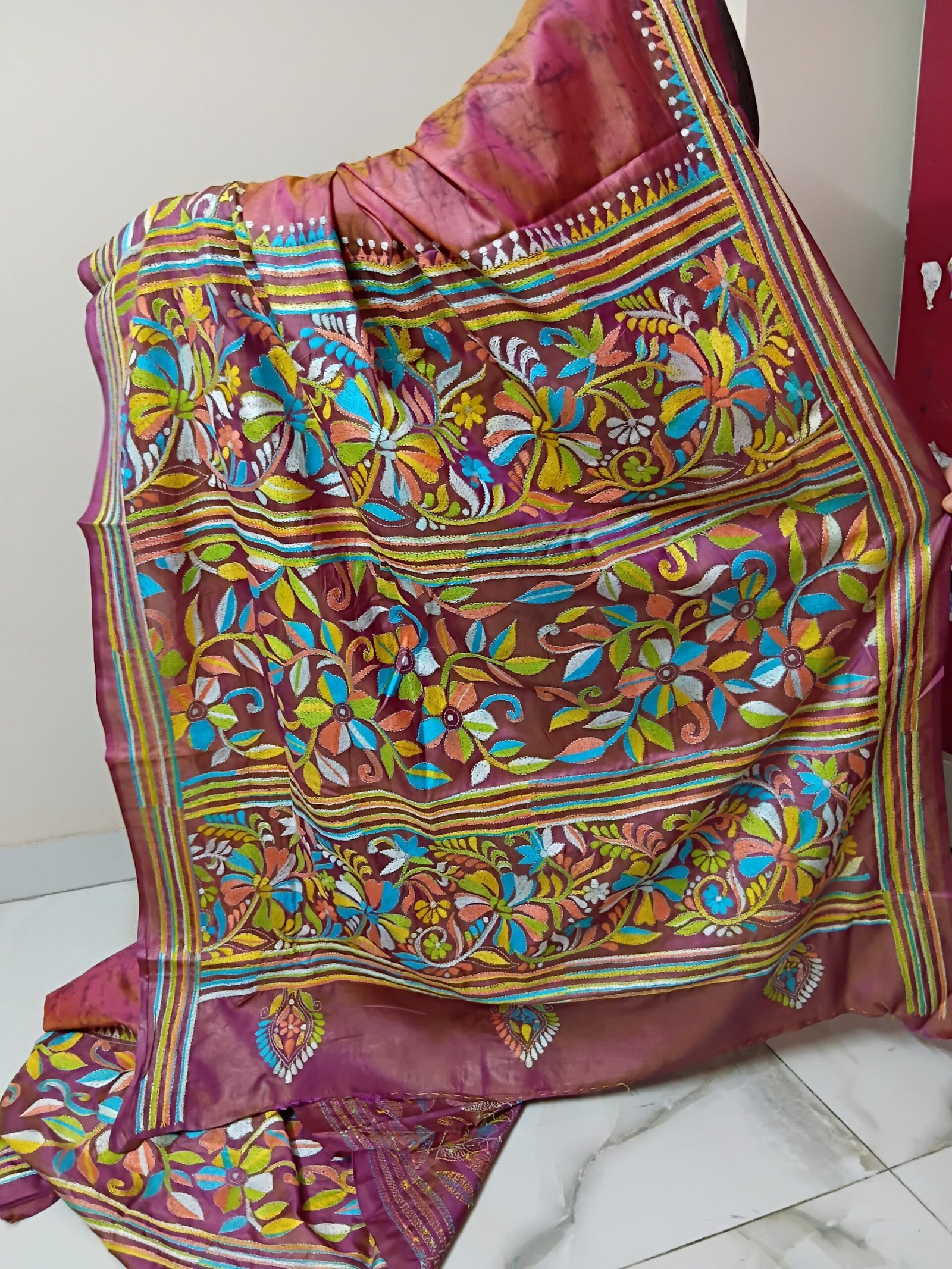 Batik Silk Kantha Stitch Saree % Handmade wax batik blended Bangalore silk Kantha stitch saree featuring beautiful batik patterns combined with intricate hand embroidery and traditional Bengal Kantha stitch work. This elegant Indian saree showcases rich textures, artistic motifs, handcrafted detailing, and traditional craftsmanship, making it perfect for festive occasions, weddings, ethnic wear, special events, and gifting.