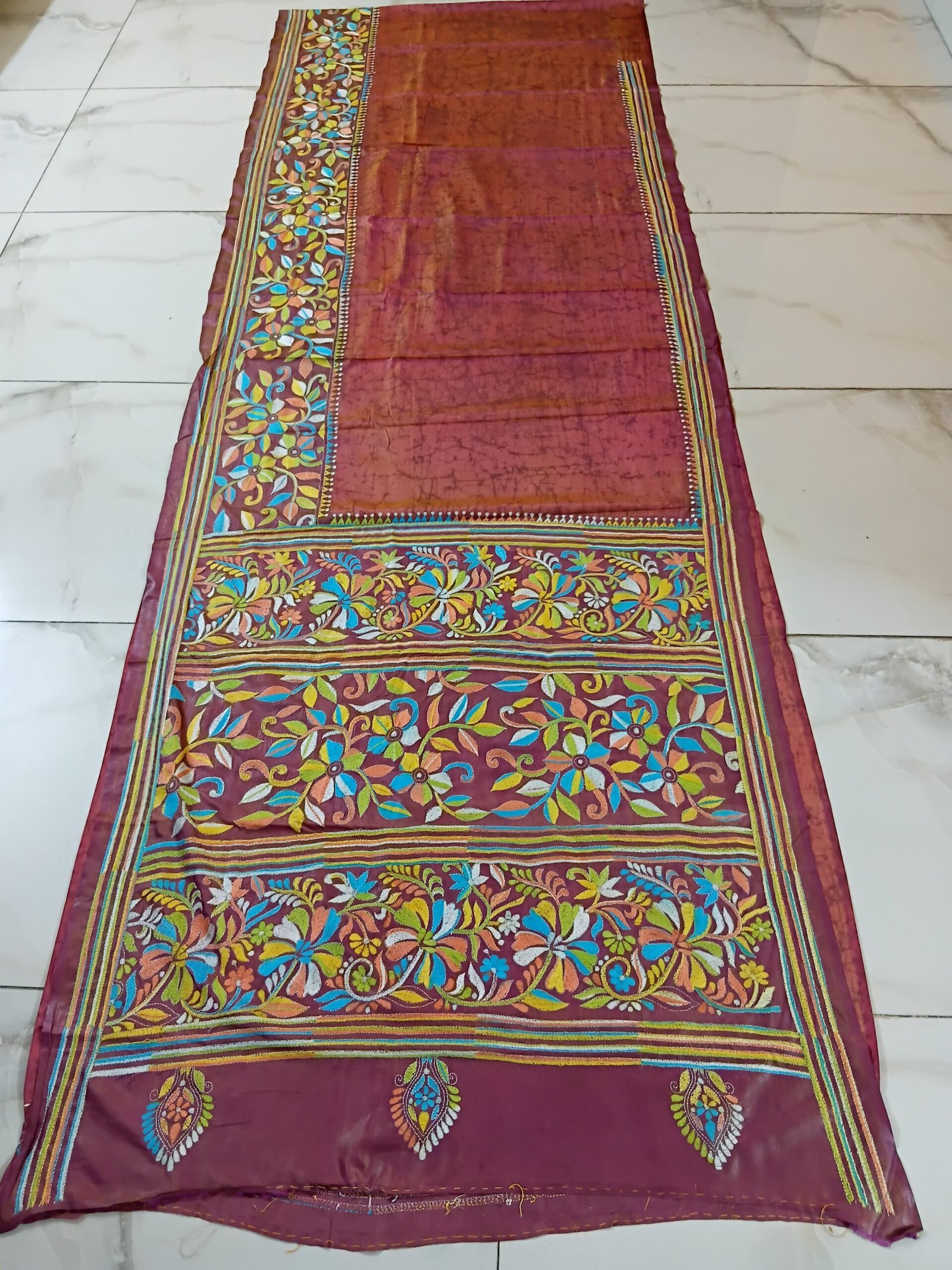 Batik Silk Kantha Stitch Saree % Handmade wax batik blended Bangalore silk Kantha stitch saree featuring beautiful batik patterns combined with intricate hand embroidery and traditional Bengal Kantha stitch work. This elegant Indian saree showcases rich textures, artistic motifs, handcrafted detailing, and traditional craftsmanship, making it perfect for festive occasions, weddings, ethnic wear, special events, and gifting.