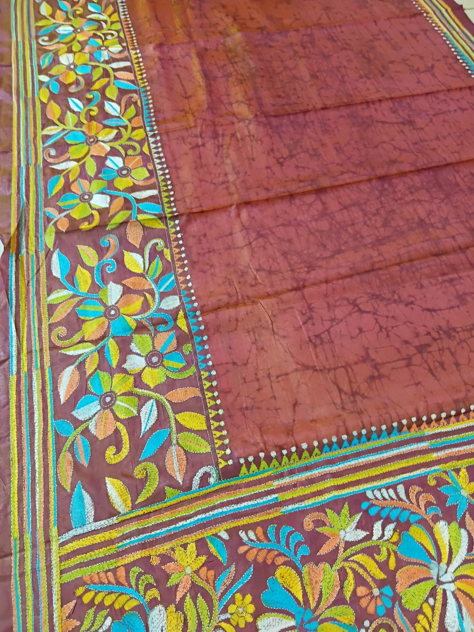 Batik Silk Kantha Stitch Saree % Handmade wax batik blended Bangalore silk Kantha stitch saree featuring beautiful batik patterns combined with intricate hand embroidery and traditional Bengal Kantha stitch work. This elegant Indian saree showcases rich textures, artistic motifs, handcrafted detailing, and traditional craftsmanship, making it perfect for festive occasions, weddings, ethnic wear, special events, and gifting.