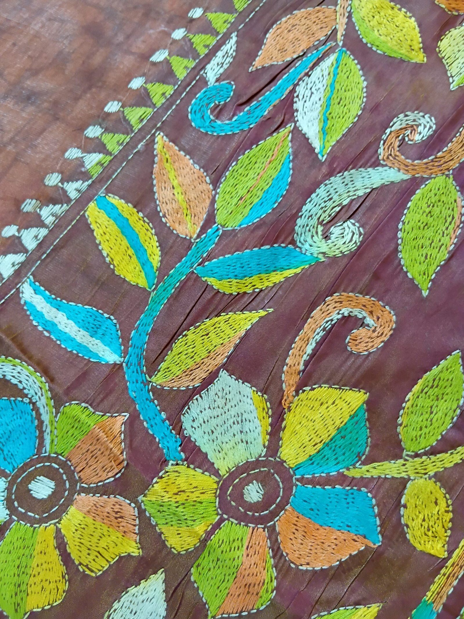 Batik Silk Kantha Stitch Saree % Handmade wax batik blended Bangalore silk Kantha stitch saree featuring beautiful batik patterns combined with intricate hand embroidery and traditional Bengal Kantha stitch work. This elegant Indian saree showcases rich textures, artistic motifs, handcrafted detailing, and traditional craftsmanship, making it perfect for festive occasions, weddings, ethnic wear, special events, and gifting.
