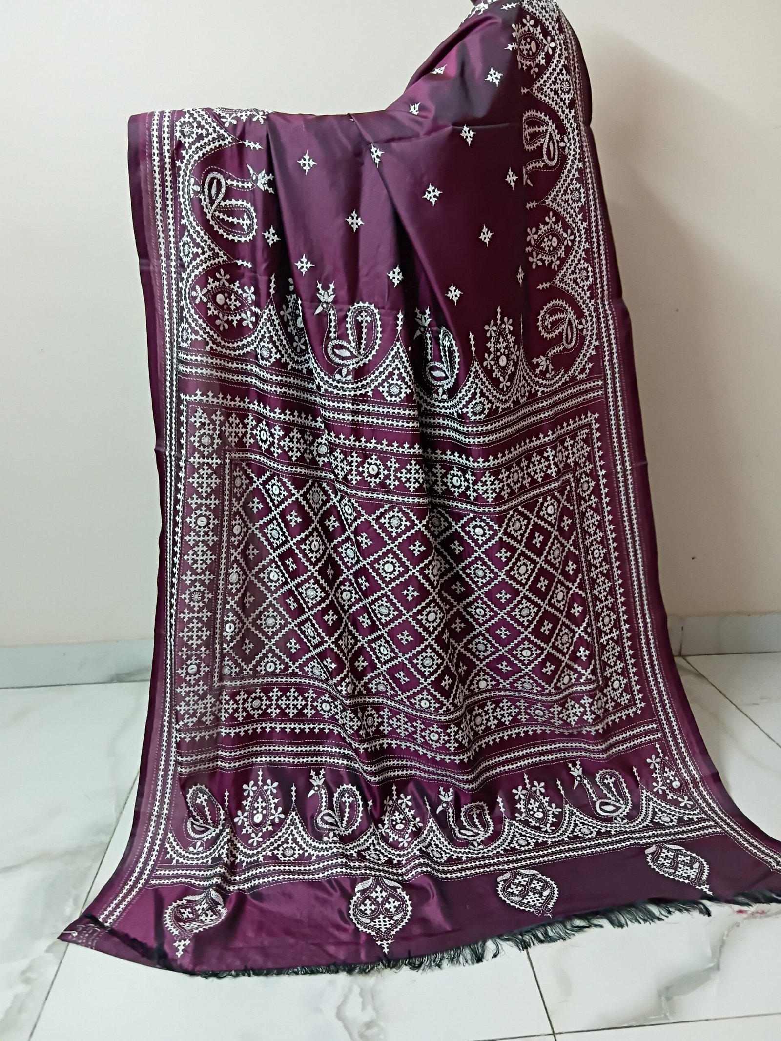 Maroon Silk Kantha Stitch Saree. Handmade Kantha stitch blended Bangalore silk saree featuring intricate hand embroidery and traditional Bengal Kantha motifs. This elegant Indian saree showcases detailed running stitch work, rich texture, and artisanal craftsmanship, making it ideal for festive occasions, weddings, ethnic wear, special events, and gifting.