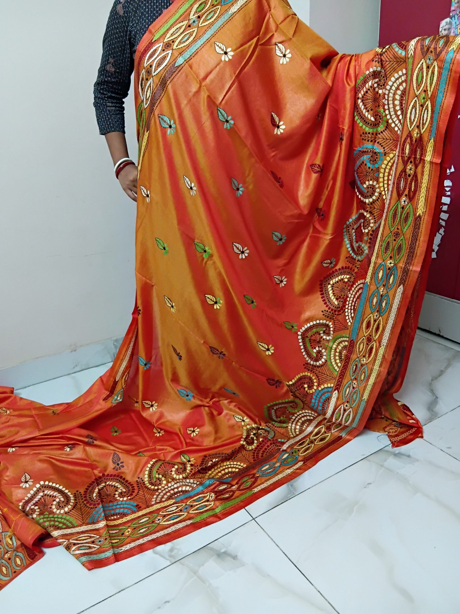 Orange Silk Kantha Stitch Saree % Orange Silk Kantha Stitch Saree. Handmade Kantha stitch blended Bangalore silk saree featuring intricate hand embroidery and traditional Bengal Kantha motifs. This elegant Indian saree showcases detailed running stitch work, rich texture, and artisanal craftsmanship, making it ideal for festive occasions, weddings, ethnic wear, special events, and gifting.