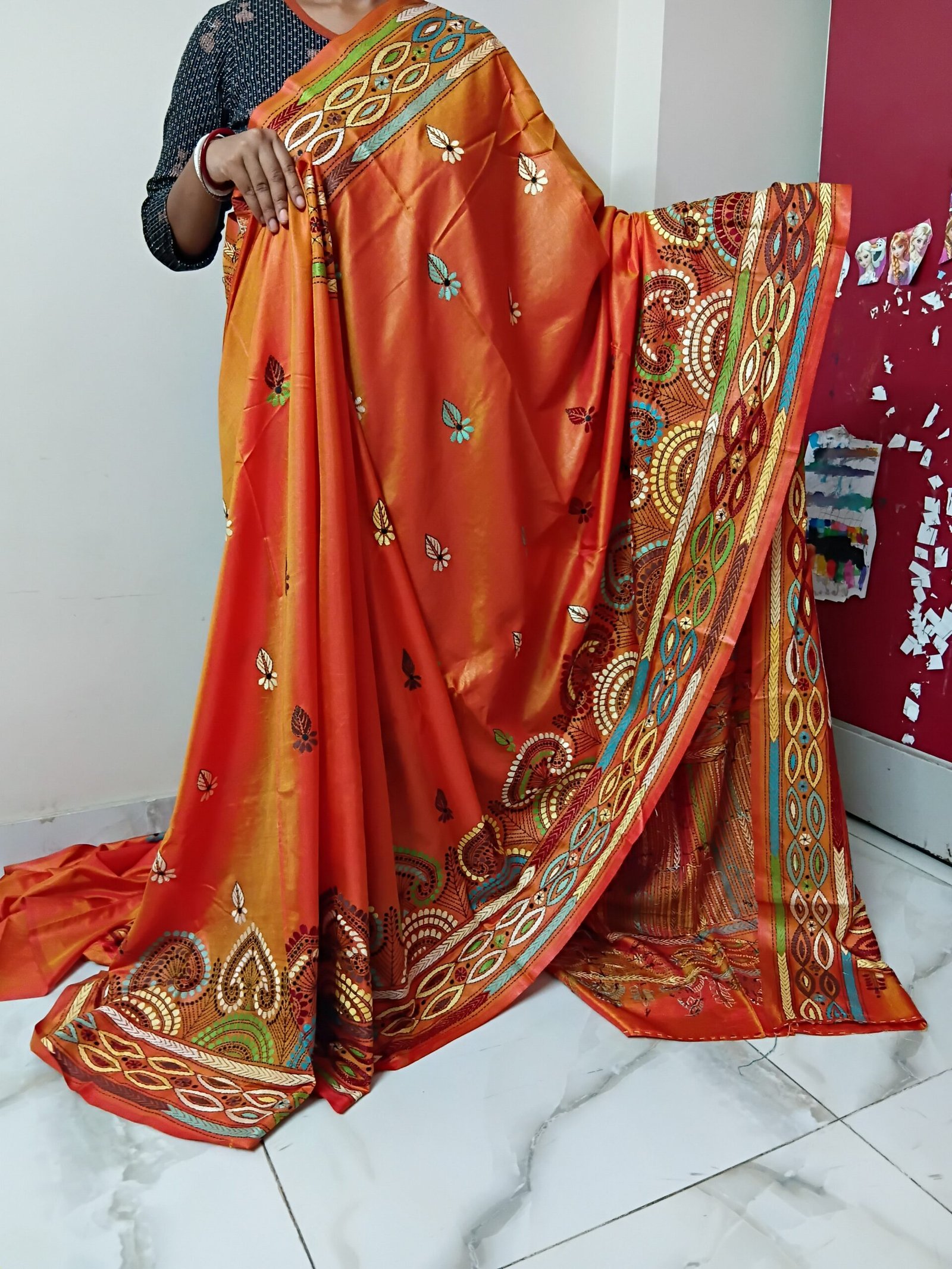 Orange Silk Kantha Stitch Saree % Orange Silk Kantha Stitch Saree. Handmade Kantha stitch blended Bangalore silk saree featuring intricate hand embroidery and traditional Bengal Kantha motifs. This elegant Indian saree showcases detailed running stitch work, rich texture, and artisanal craftsmanship, making it ideal for festive occasions, weddings, ethnic wear, special events, and gifting.