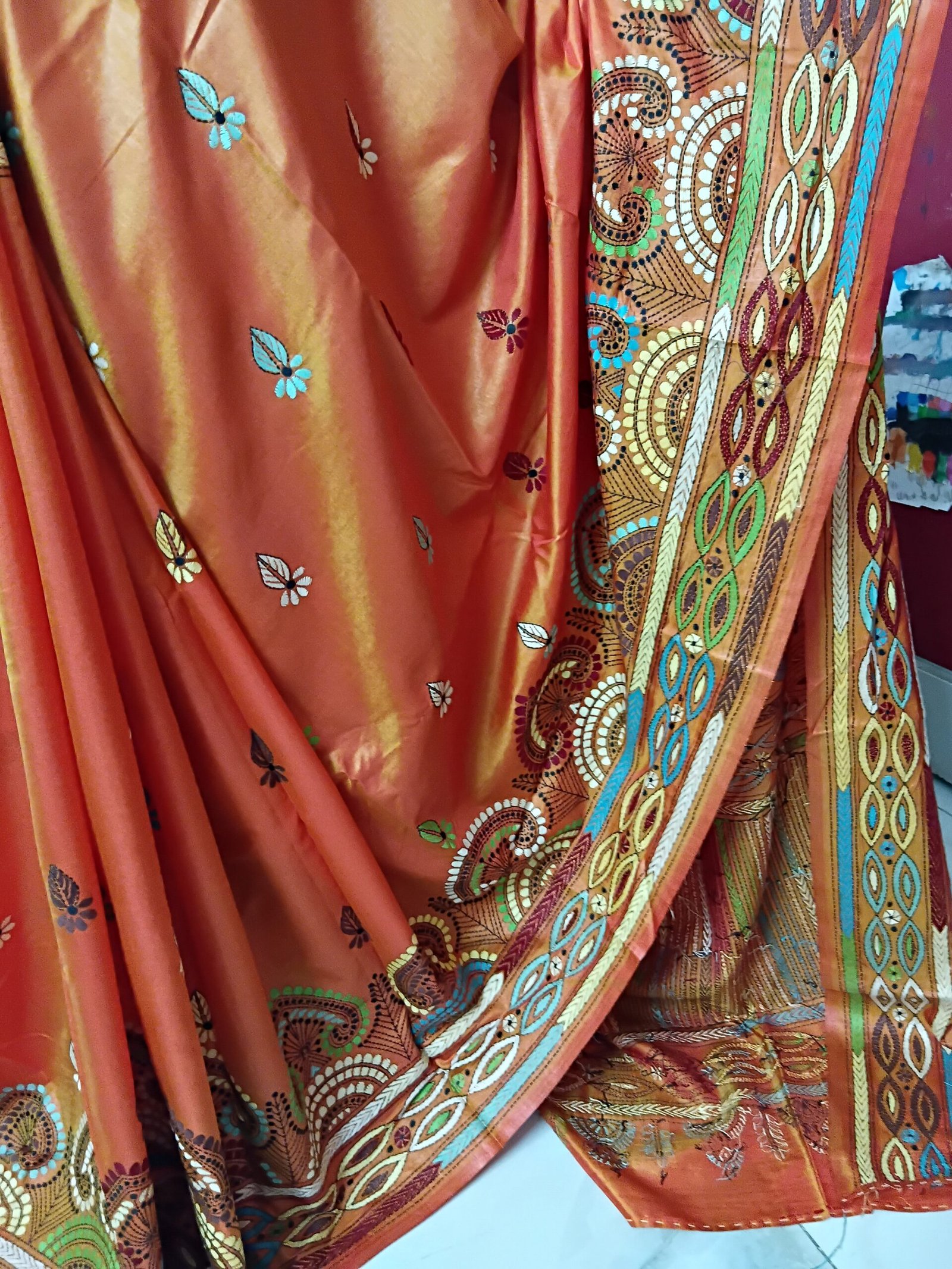 Orange Silk Kantha Stitch Saree % Orange Silk Kantha Stitch Saree. Handmade Kantha stitch blended Bangalore silk saree featuring intricate hand embroidery and traditional Bengal Kantha motifs. This elegant Indian saree showcases detailed running stitch work, rich texture, and artisanal craftsmanship, making it ideal for festive occasions, weddings, ethnic wear, special events, and gifting.