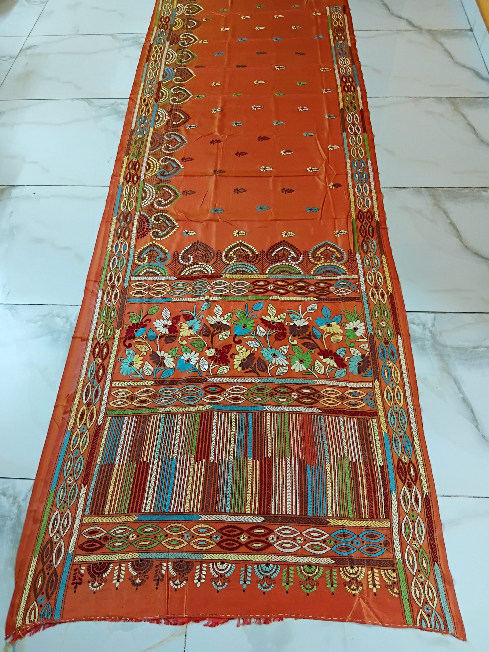 Orange Silk Kantha Stitch Saree % Orange Silk Kantha Stitch Saree. Handmade Kantha stitch blended Bangalore silk saree featuring intricate hand embroidery and traditional Bengal Kantha motifs. This elegant Indian saree showcases detailed running stitch work, rich texture, and artisanal craftsmanship, making it ideal for festive occasions, weddings, ethnic wear, special events, and gifting.