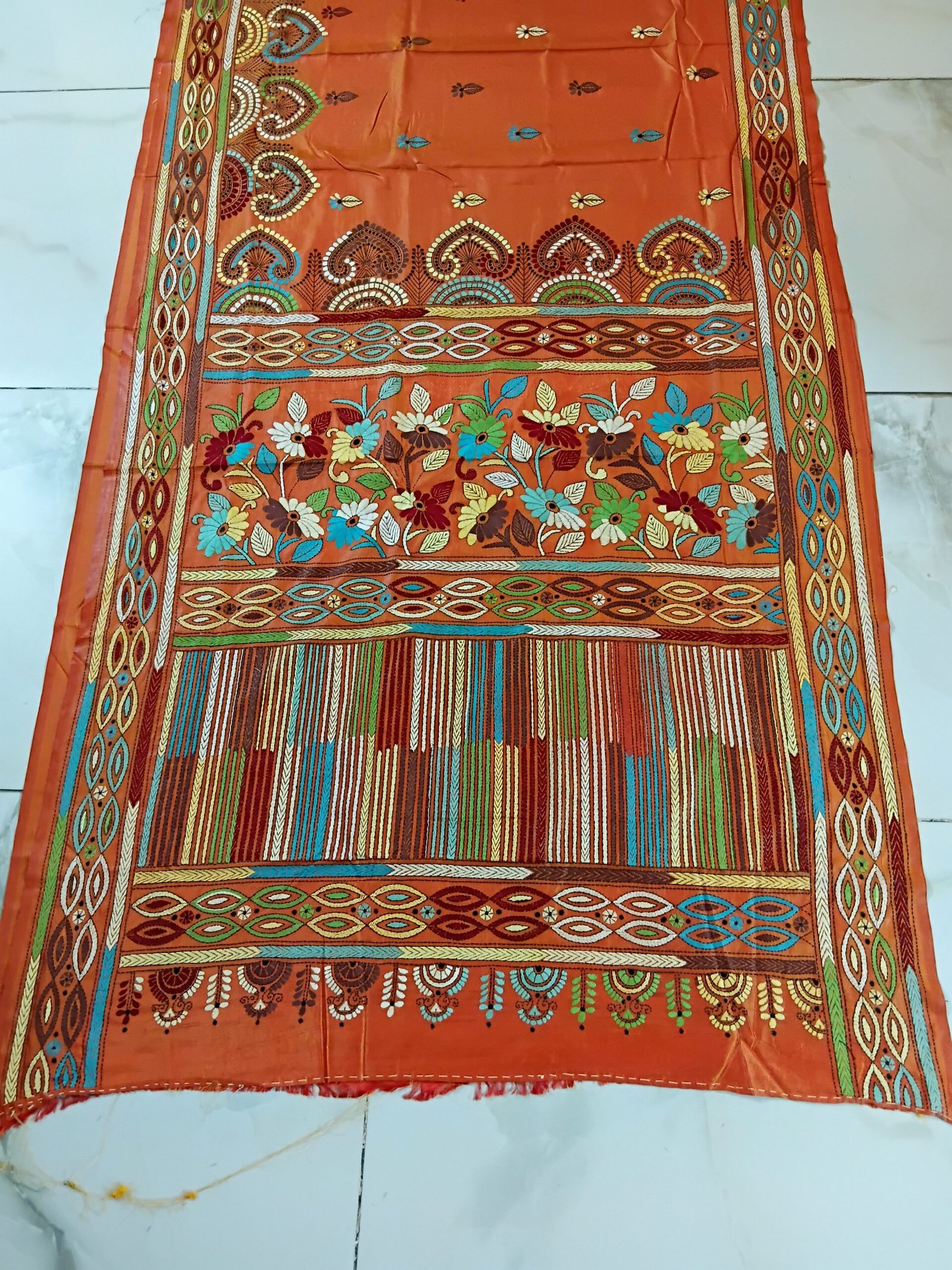 Orange Silk Kantha Stitch Saree % Orange Silk Kantha Stitch Saree. Handmade Kantha stitch blended Bangalore silk saree featuring intricate hand embroidery and traditional Bengal Kantha motifs. This elegant Indian saree showcases detailed running stitch work, rich texture, and artisanal craftsmanship, making it ideal for festive occasions, weddings, ethnic wear, special events, and gifting.