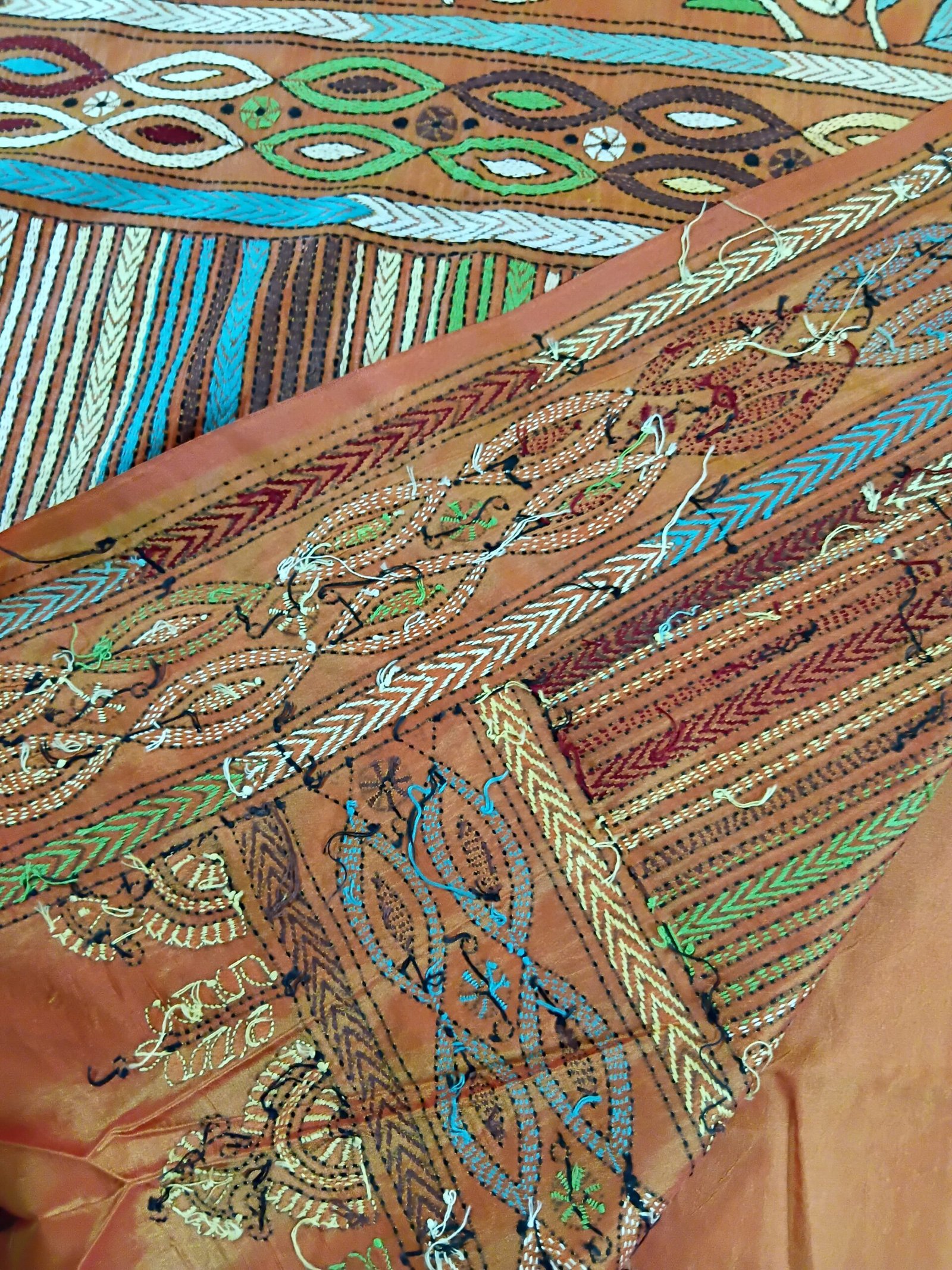Orange Silk Kantha Stitch Saree % Orange Silk Kantha Stitch Saree. Handmade Kantha stitch blended Bangalore silk saree featuring intricate hand embroidery and traditional Bengal Kantha motifs. This elegant Indian saree showcases detailed running stitch work, rich texture, and artisanal craftsmanship, making it ideal for festive occasions, weddings, ethnic wear, special events, and gifting.