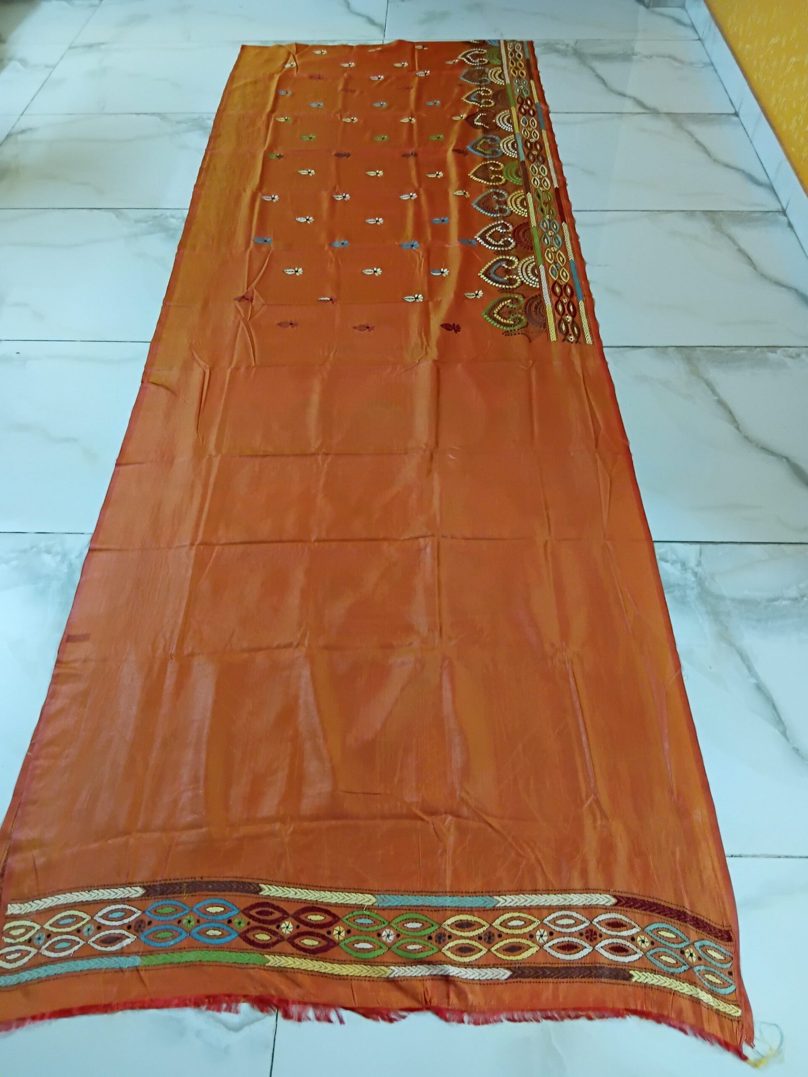 Orange Silk Kantha Stitch Saree % Orange Silk Kantha Stitch Saree. Handmade Kantha stitch blended Bangalore silk saree featuring intricate hand embroidery and traditional Bengal Kantha motifs. This elegant Indian saree showcases detailed running stitch work, rich texture, and artisanal craftsmanship, making it ideal for festive occasions, weddings, ethnic wear, special events, and gifting.