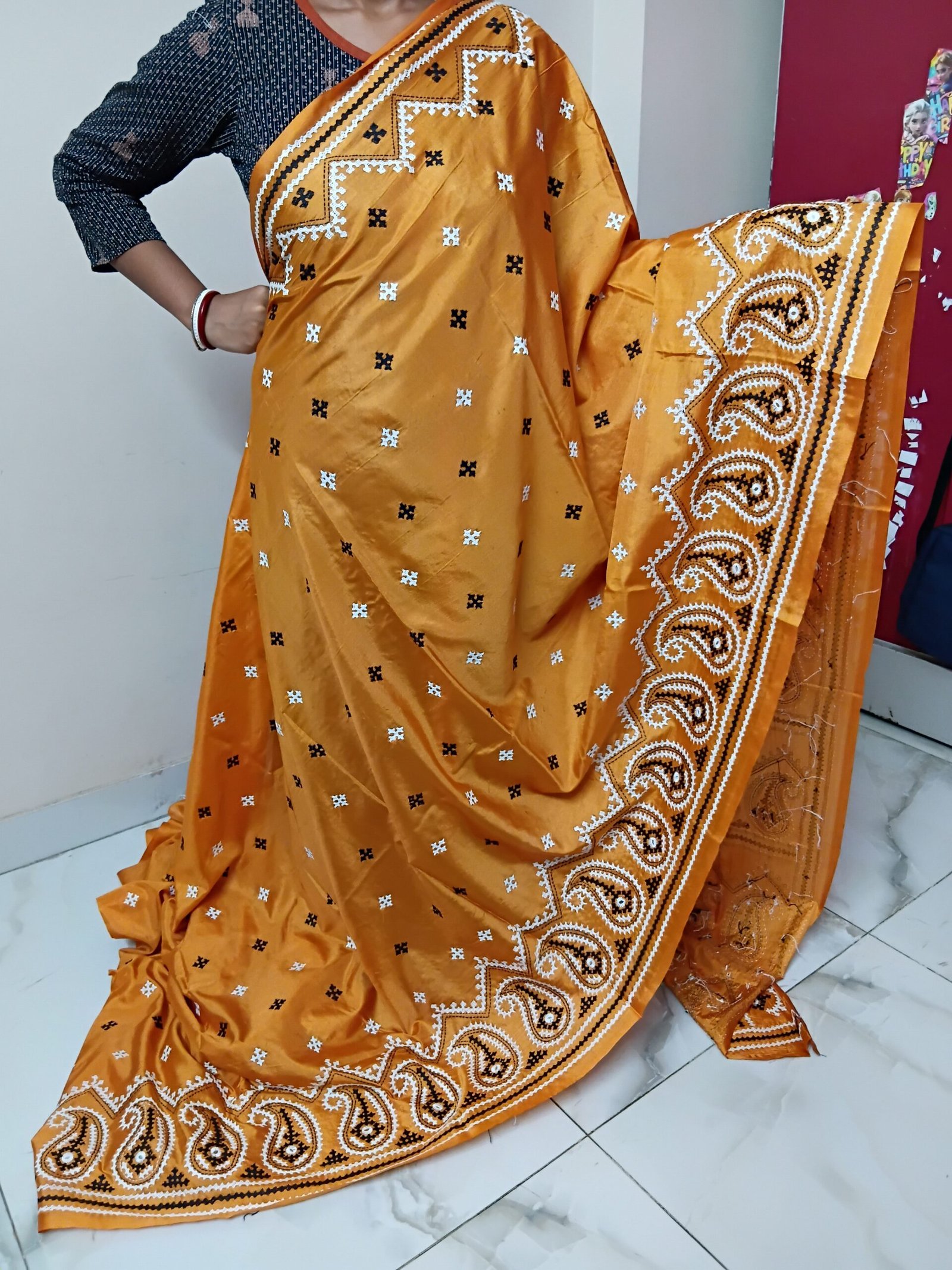 Orange Kalka Motif Gujarati Stitch Saree – Blended Bangalore Silk % Front view of orange Gujarati Stitch saree with hand embroidery