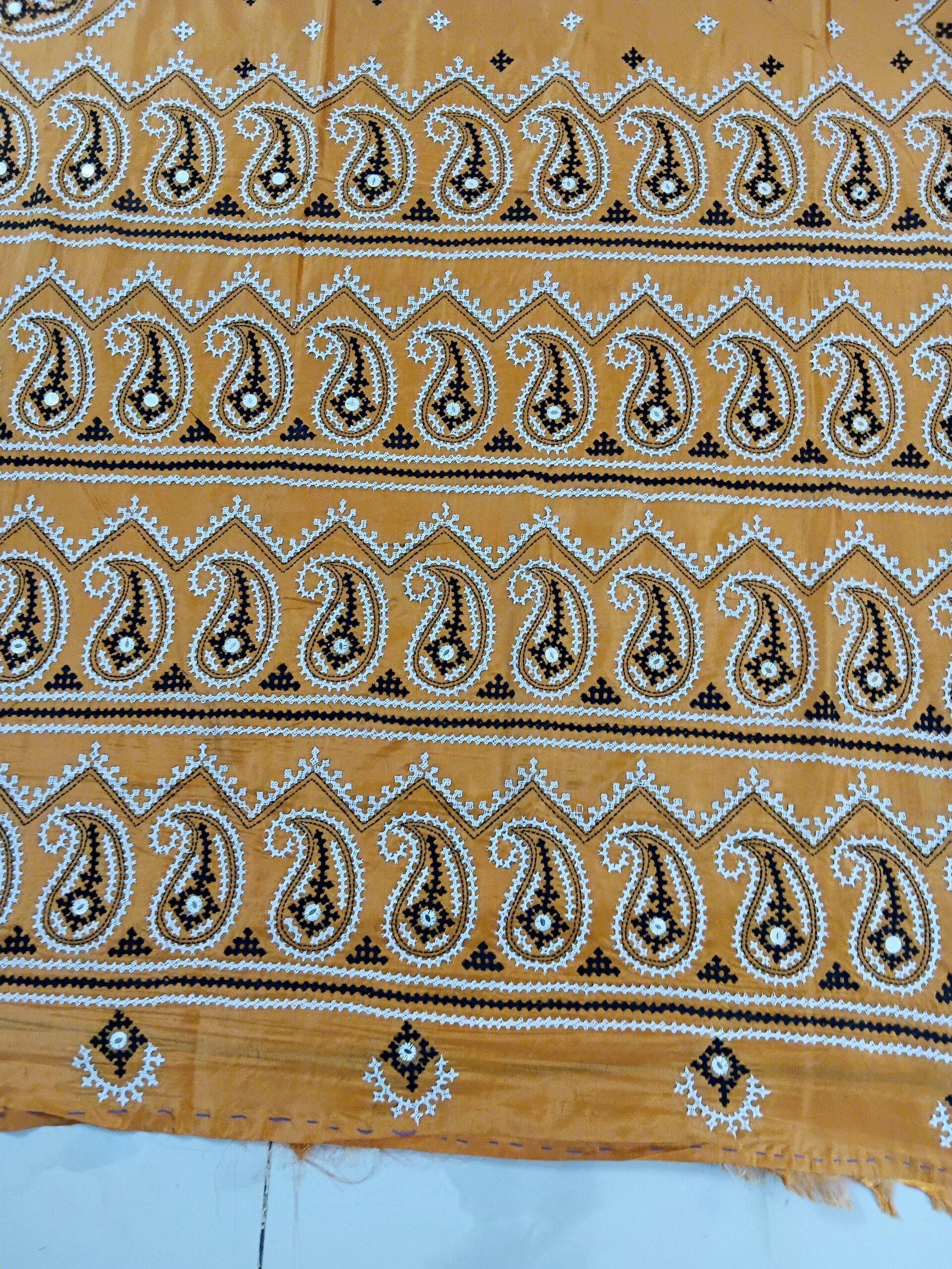 Orange Kalka Motif Gujarati Stitch Saree – Blended Bangalore Silk % Close-up of Kalka motif hand embroidery on orange saree