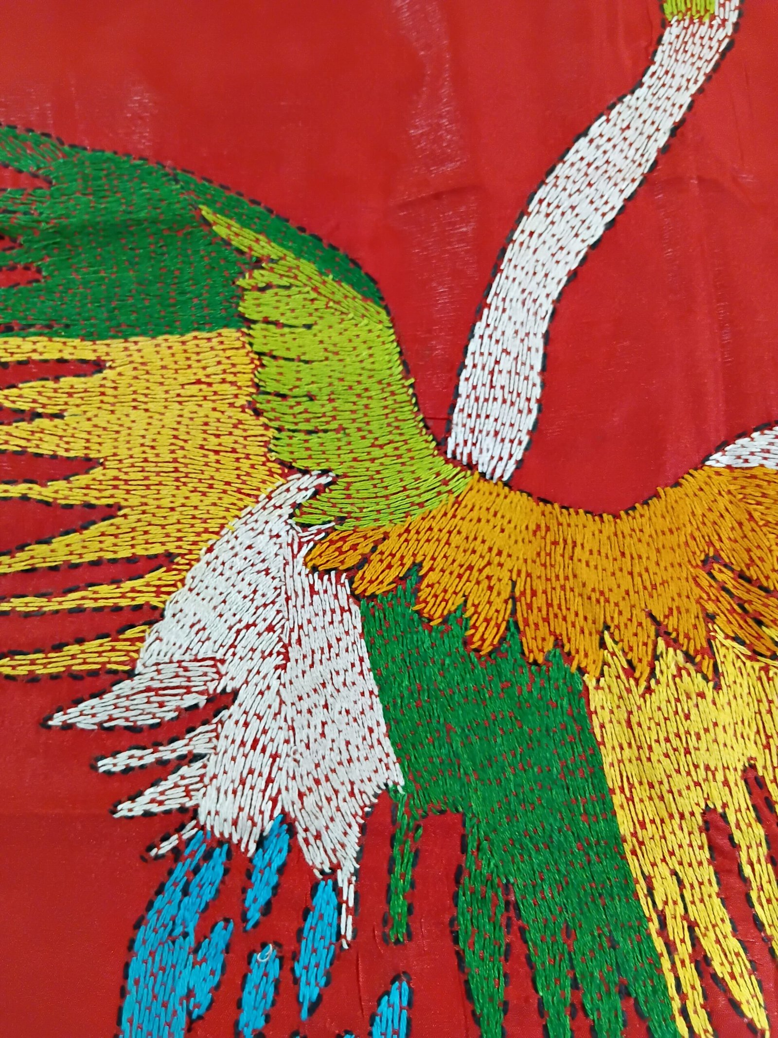 Red Bird Motif Kantha Stitch Saree on Blended Bangalore Silk % Close-up of bird motif Kantha stitching on red saree